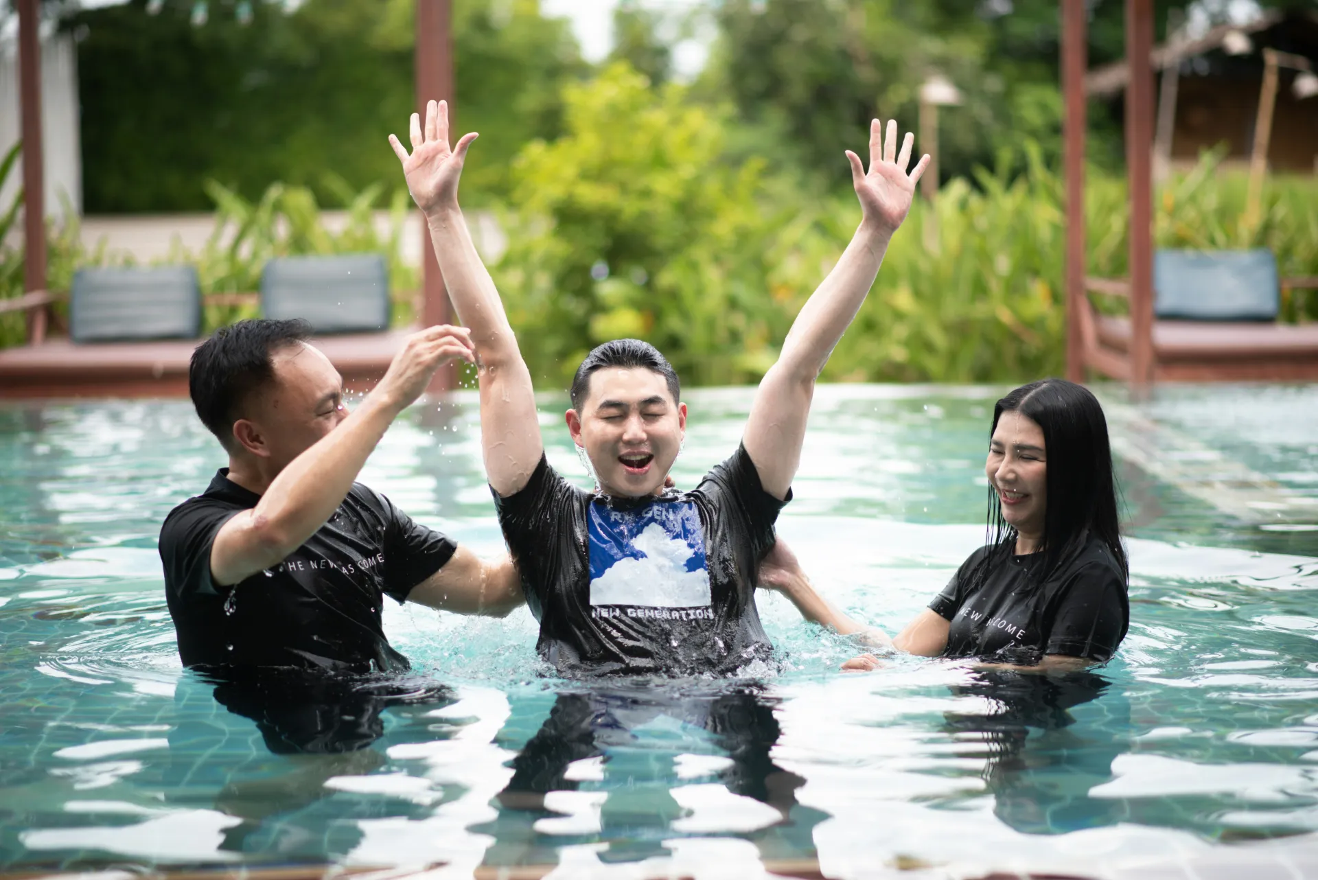 Community baptism gathering outdoors